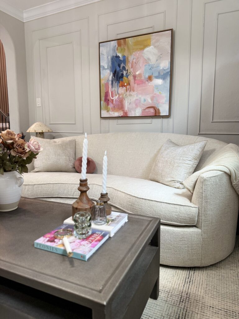 Light colored spring wall art in living room The Woodlands interior design Emma's Interior