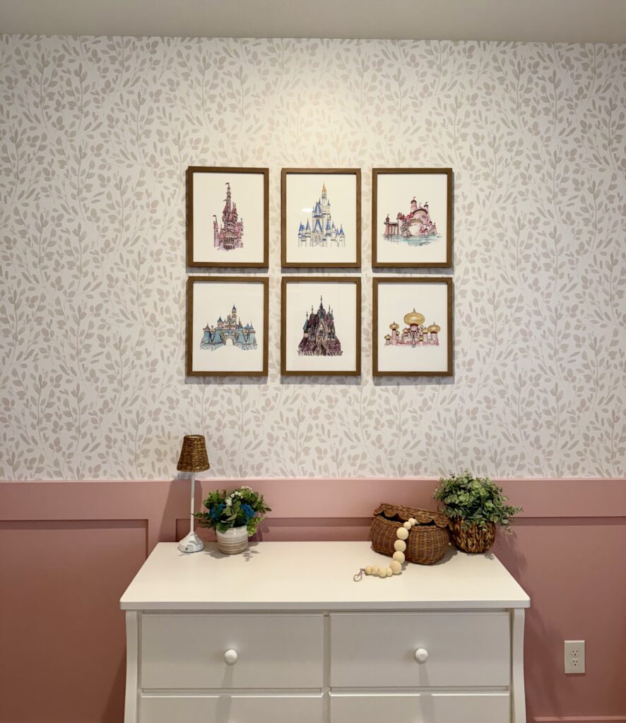Elegant gold framed princess castle art prints styled over a white dresser in Cypress Texas