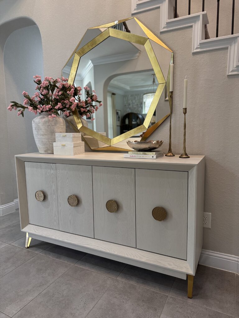 Modern light oak credenza styling in a Woodlands, TX home by Emma's Interior