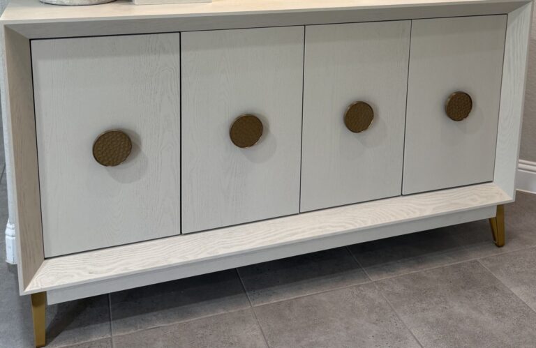 Modern light oak credenza styling in a Woodlands, TX home by Emma's Interior.