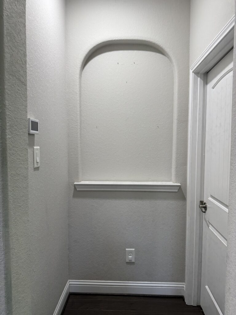 A before photo of an empty niche in a home